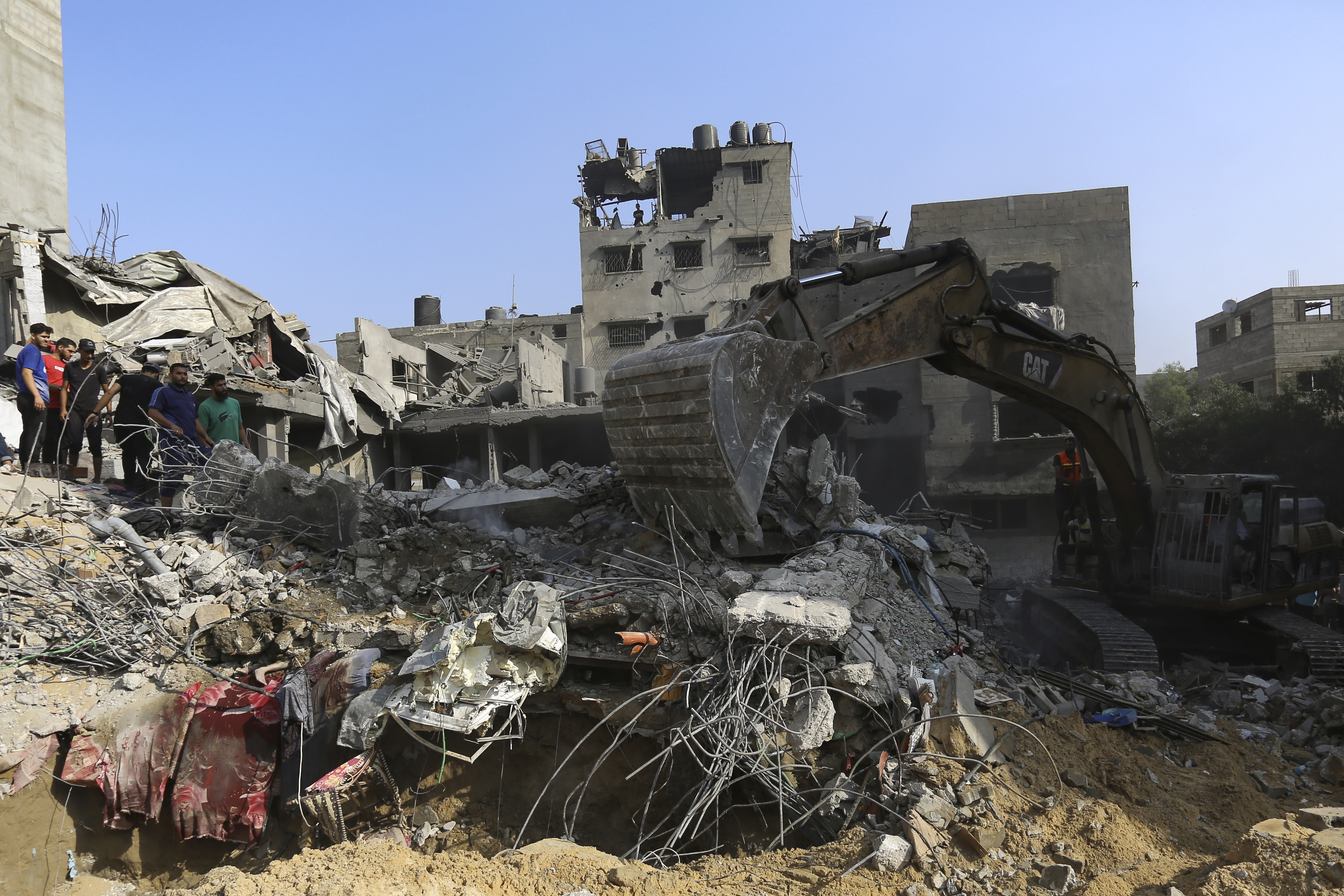 Palestinians inspect the damage of destroyed houses after Israeli airstrikes on Gaza City, Tuesday, Oct. 24, 2023. Photo / AP