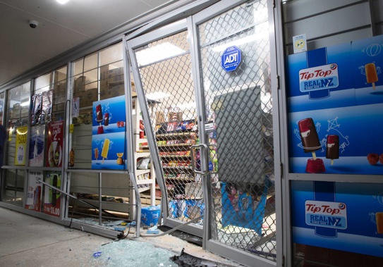 The damage left behind by ram raid thieves at a shop in Whenuapai. Photo / Hayden Woodward
