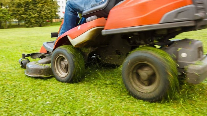 A young boy died after being run over by a lawnmower. Photo / 123rf
