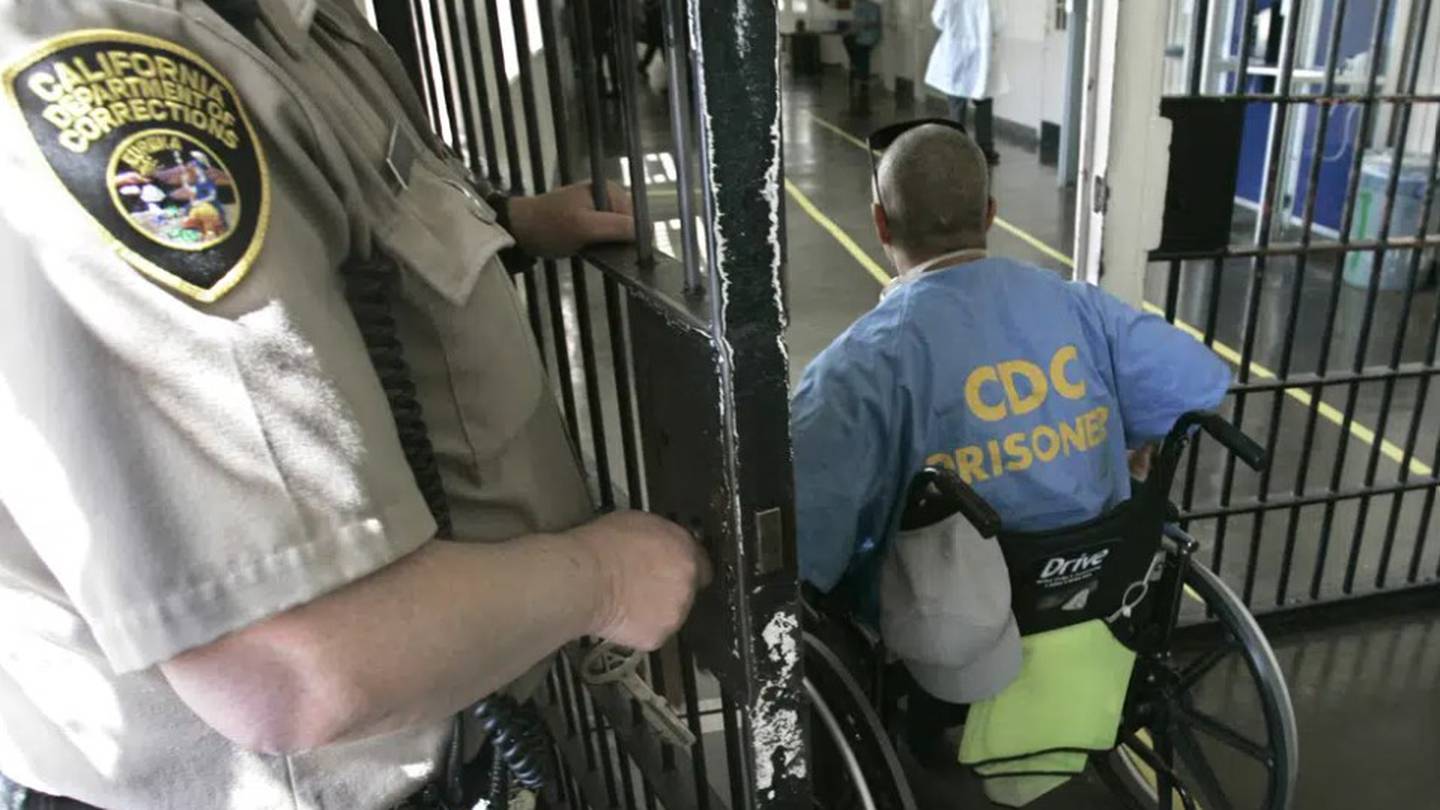 A wheelchair-bound inmate wheels himself through a checkpoint at the California Medical Facility. Photo / AP