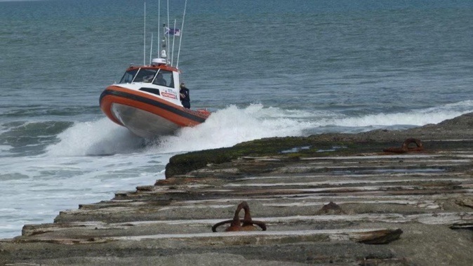 Two people have died after a boat capsized off Pātea this morning. Photo / Coastguard South Taranaki