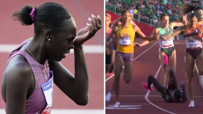 Athing Mu got tangled up in the middle of the track and fell. Photo / AP / Twitter