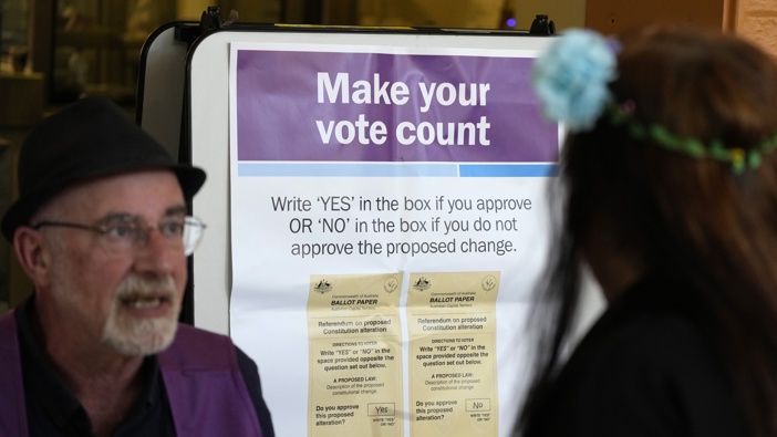 A polling place volunteer, left, assists a woman at a polling place in Redfern as Australians cast their final votes in Sydney, Saturday, Oct. 14, 2023. Photo / AP