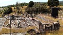 The remnants of a demolished red brick building at the Prohibition Mine in Waiuta. Photo / DoC