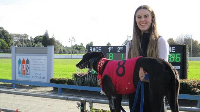 Chloe Watson and her greyhound Teeing Off pictured after winning her first race as a trainer in June 2022. Photo / GRNZ Facebook