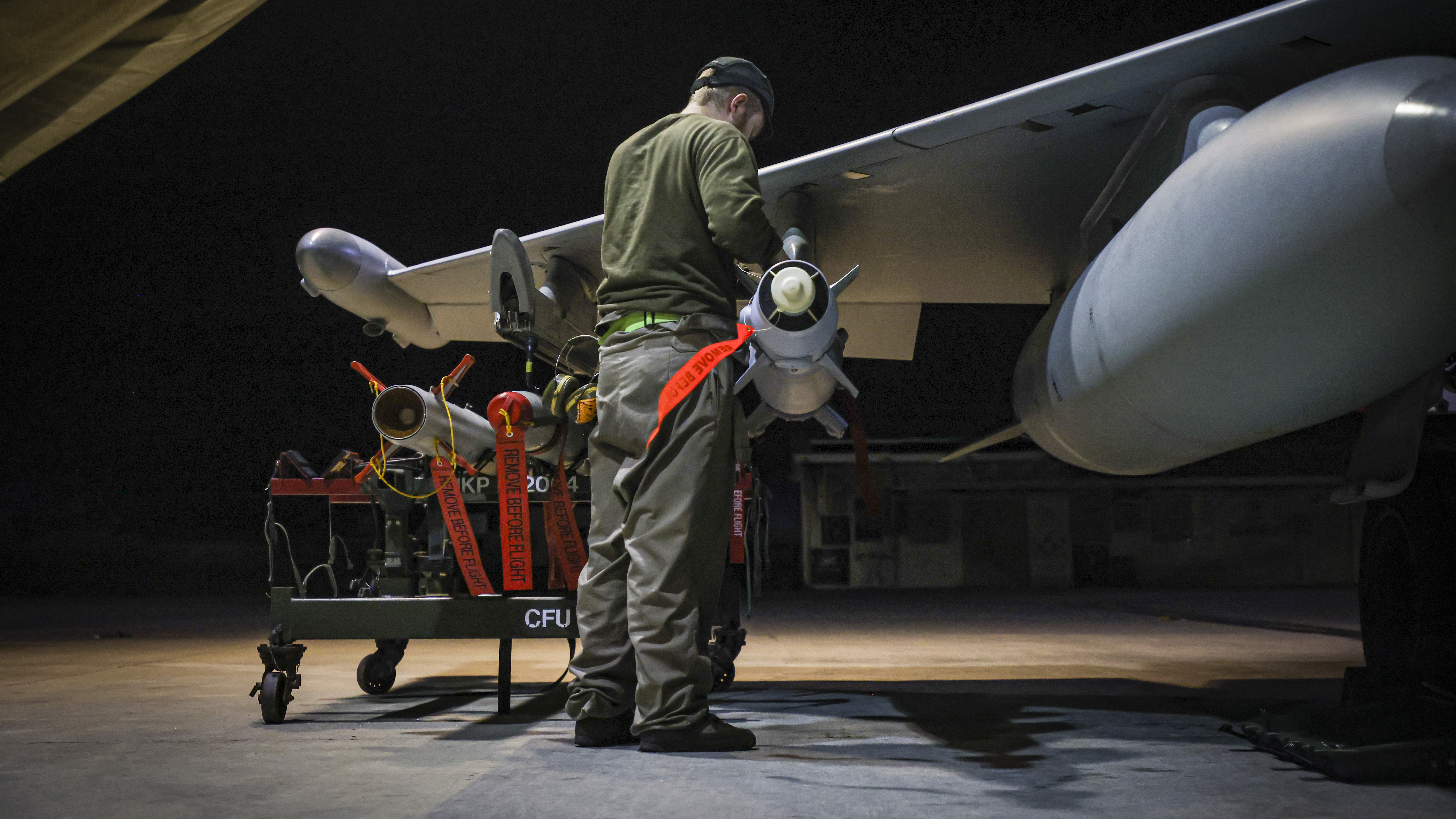 In this image provided by the UK Ministry of Defence, RAF Armourers (Weapon Technicians) prepare a Royal Air Force Typhoon FGR4 for air strikes against Houthi military targets in Yemen, in RAF Akrotiri, Sunday, Jan. 21, 2024. Photo / Ministry of Defence via AP