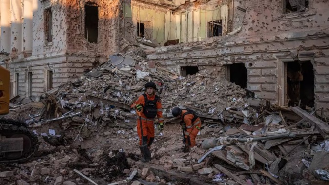 Emergency workers dig through rubble on Monday in Sumy after the strikes. Photo / The Washington Post