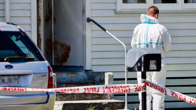 Police forensics inspect a house on Douglas Crescent, Hamilton, where help was sought after a violent attack resulted in the death of a child and injuries to its mother New Zealand Herald photograph by Dean Purcell 01 January 2025