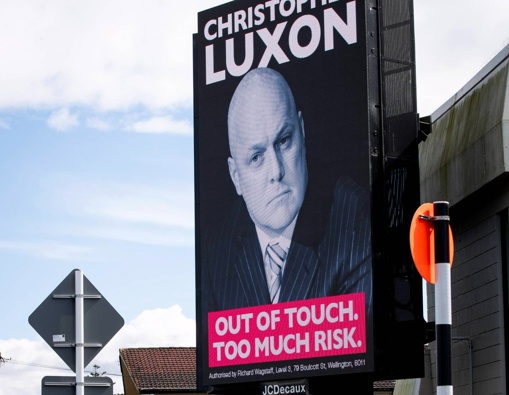 A digital billboard on the corner of Sandringham Rd and St Lukes Rd featuring Christopher Luxon and the slogan "Out of touch. Too much risk.". Photo / Jason Oxenham