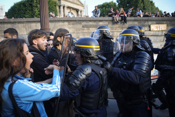 Police officers face protesters on Concorde square during a protest in Paris, France, Friday, June 30, 2023. French President Emmanuel Macron urged parents Friday to keep teenagers at home and proposed restrictions on social media to quell rioting spreading across France over the fatal police shooting of a 17-year-old driver. Photo / AP