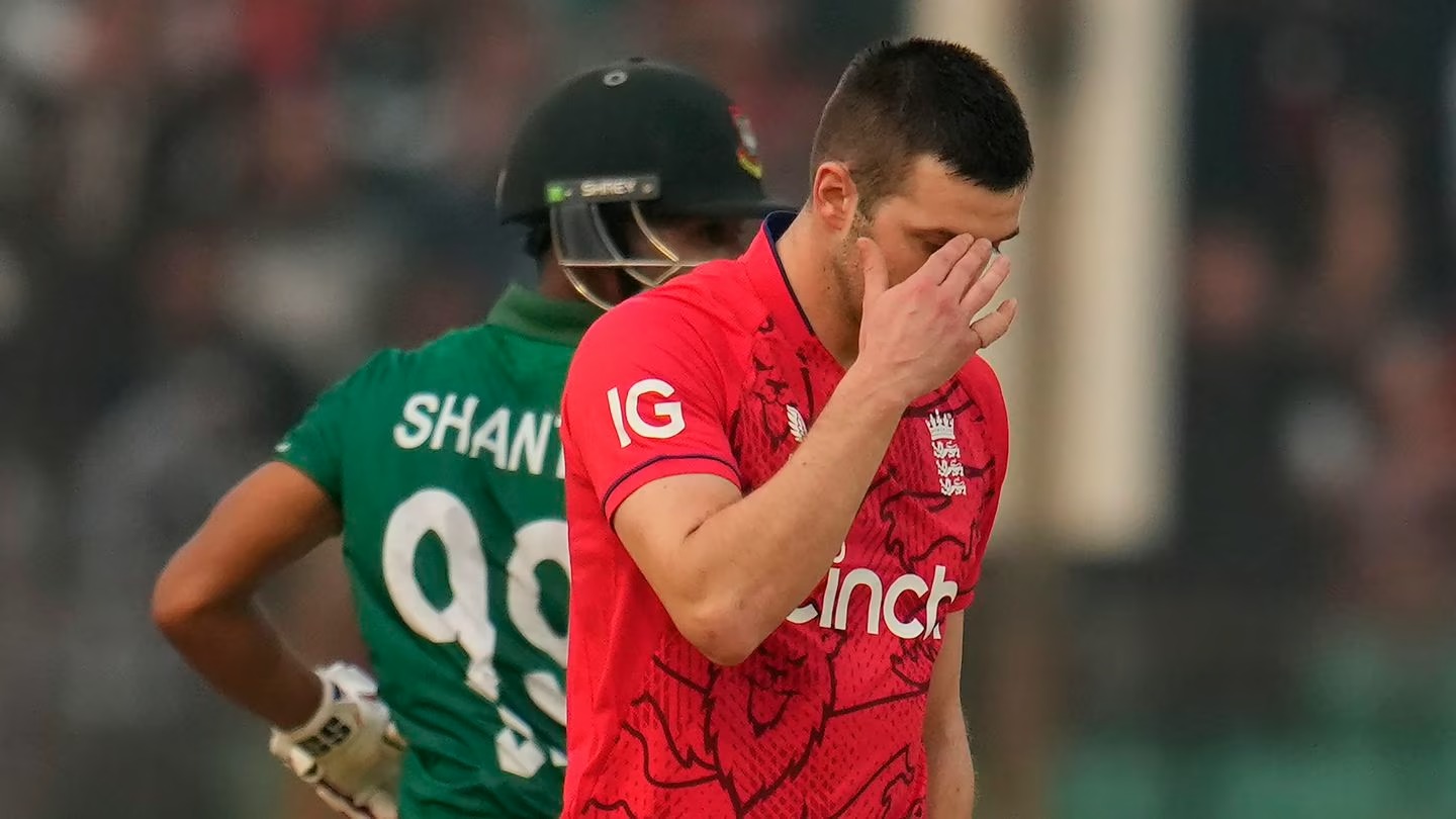 England's Mark Wood (R) reacts after being hit for a boundary by Bangladesh's Najmul Hossain Shanto. Photo / AP