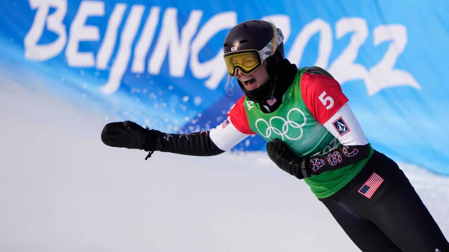 United States' Lindsey Jacobellis celebrates after winning a gold medal in the women's cross at the 2022 Winter Olympics. (Photo / AP)