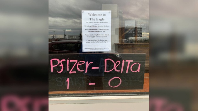 A Bluff pub is in hot water for putting a sign up on their window that compares Ardern and Bloomfield to Hitler and Goebbels and Covid response to Nazi Jewish atrocities. (Photo / Marcus Lush / Twitter)