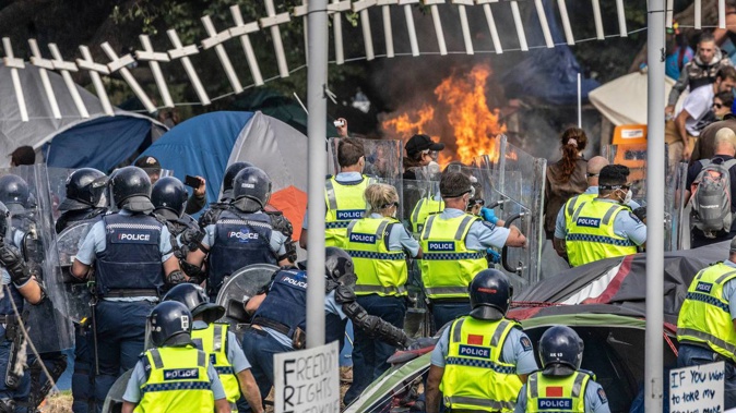 Police clearing Parliament grounds of protesters and tents. Photo / Mike Scott