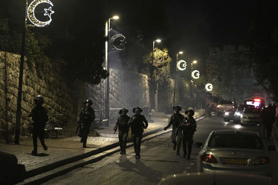 Israeli Border Police are deployed near the Lions' Gate to the Old City of Jerusalem during a raid by police of Al-Aqsa Mosque. Photo / AP