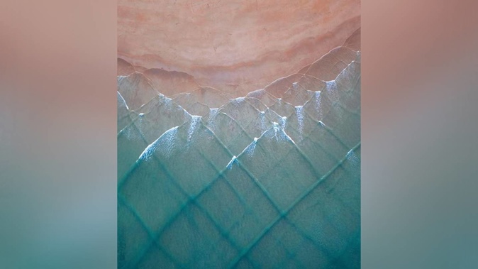A Kiwi photographer has captured an incredible aerial shot of a tartan-styled ocean wave break which is being described by some as a "phenomenon". Photo / Jack Burden Images
