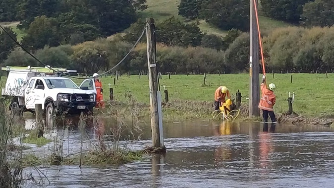 Top Energy crews work to restore power after the wild weather, with some homes still in the dark.