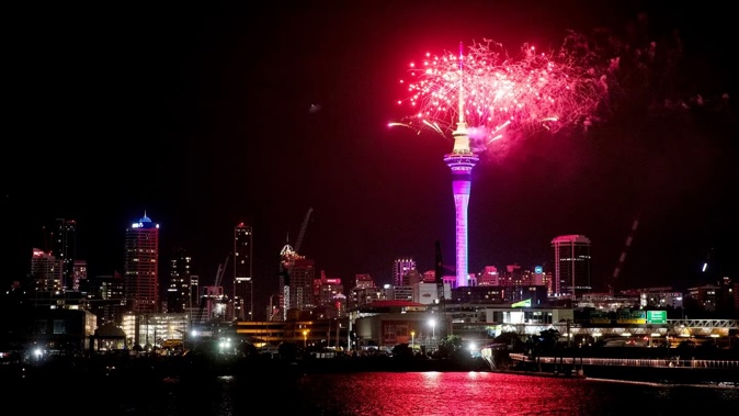 SkyCity's Sky Tower celebrating 2023's arrival. Photo / Dean Purcell