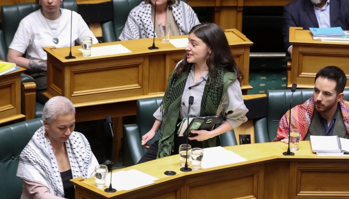 A video frame-brab of Greens co-leader Chlöe Swarbrick leavinf the deabting chamber, Parliament, Wellington, 13 August, 2025. NZ Herald photograph by Mark Mitchell