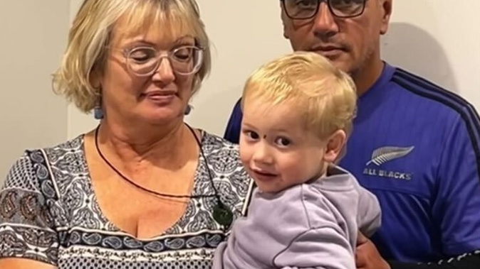 Colin Rangitaawa, pictured with wife Daphne and grandson Zakai, suffered chemical burns after standing in a puddle of caustic soda. Photo / Supplied