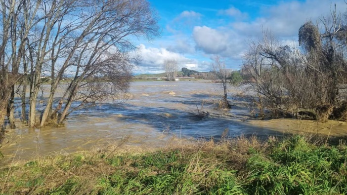 A severe weather event, including heavy rain, caused the Motueka River to burst its banks and flood. Photo / RNZ
