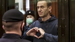 In this handout photo taken from video provided by the Moscow City Court on Feb. 2, 2021, Russian opposition leader Alexei Navalny shows a heart symbol while standing in a defendants’ cage during a hearing in the Moscow City Court in Moscow, Russia. President Vladimir Putin says he supported an idea to release Navalny in a prisoner exhcnage just days before the man who was his biggest foe died. Photo / AP