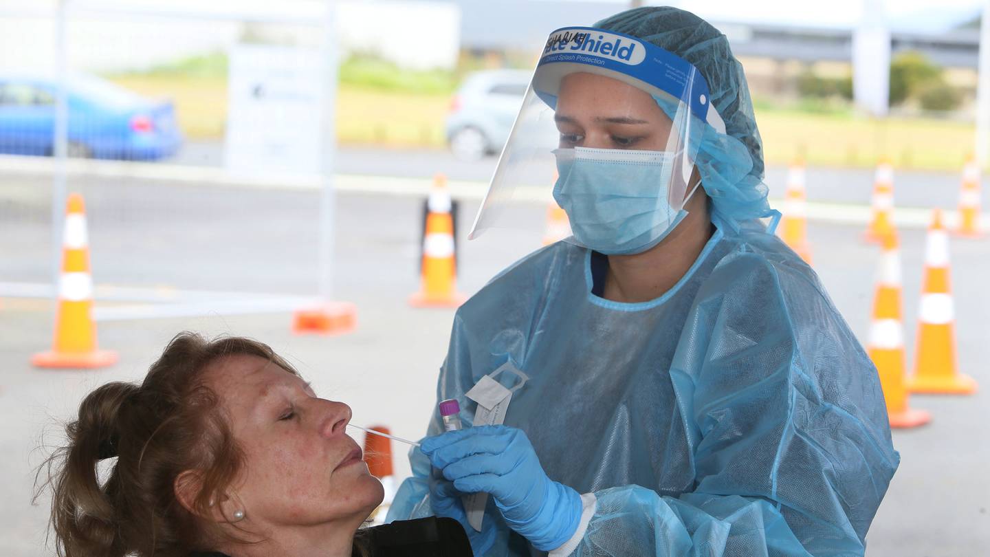 Covid-19 swabber Shariah Brim-Saddler at the Ngāpuhi's Kaikohe testing station taking a swab from DHB nurse Donna Snell. (Photo / Tania Whyte)