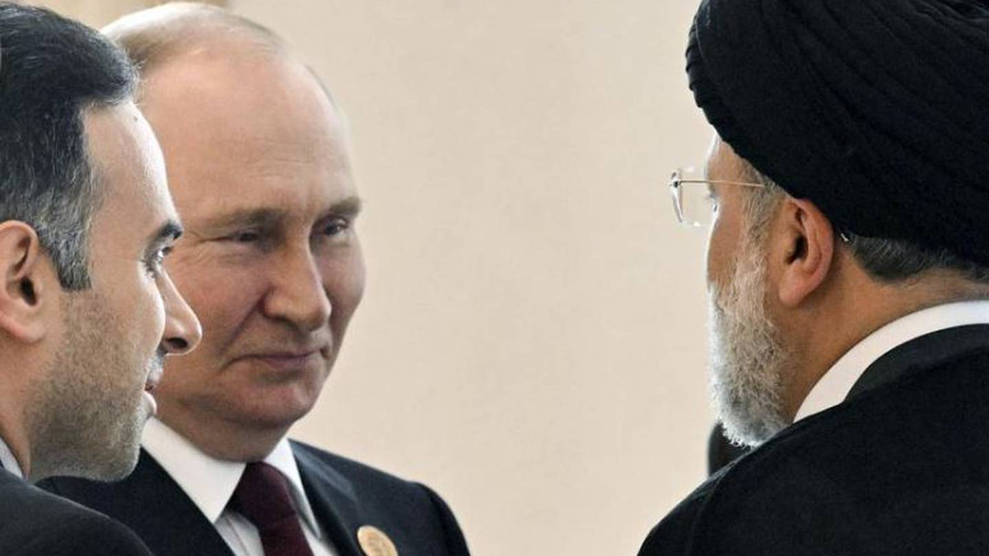 Vladimir Putin speaks to Iran's President Ebrahim Raisi (back to the camera) on the sideline of the summit of Caspian Sea littoral states in Ashgabat, Turkmenistan. Photo / AP