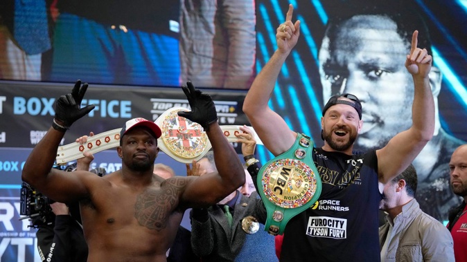 British heavyweight boxers Tyson Fury and Dillian Whyte pose as they take part in their weigh-in at the Boxpark Wembley venue, near Wembley Stadium. (Photo / AP)
