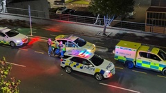 Police on the scene of the shooting last night in Auckland city. (Photo / Rahul Bhattarai)
