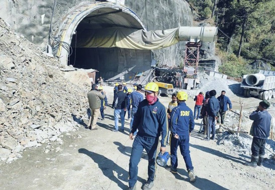 Rescuers outside a collapsed road tunnel where at least 40 workers were trapped by a landslide in northern in Uttarakhand, India. Photo / AP