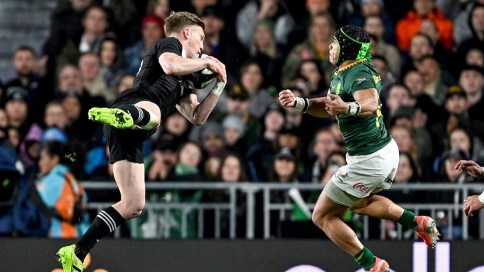 Damian McKenzie battles Springboks wing Cheslin Kolbe under a high ball at Eden Park in Auckland last Saturday. Photo / Photosport
