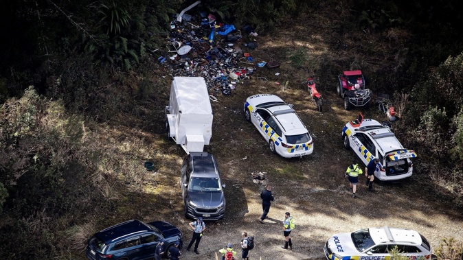 Police at one of the campsites just off Te Anga Rd, near Waitomo, where Tom Phillips and his children were hiding for the last four years. Photo / Dean Purcell
