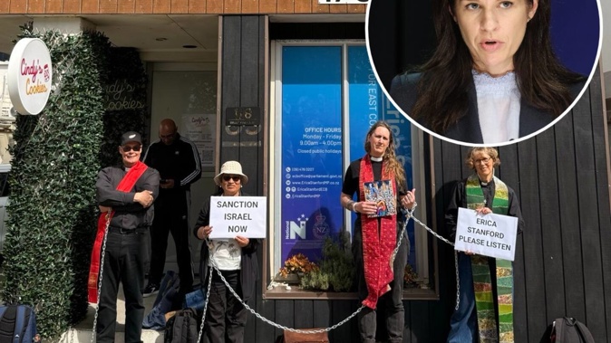 Three priests are protesting at Erica Stanford's electorate office in Browns Bay, Auckland, on Monday, September 29, 2025. Photo / Common Grace