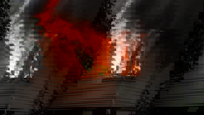 Three fire trucks were sent to the home on Hereford St at around 6.50pm. Photo / NZME