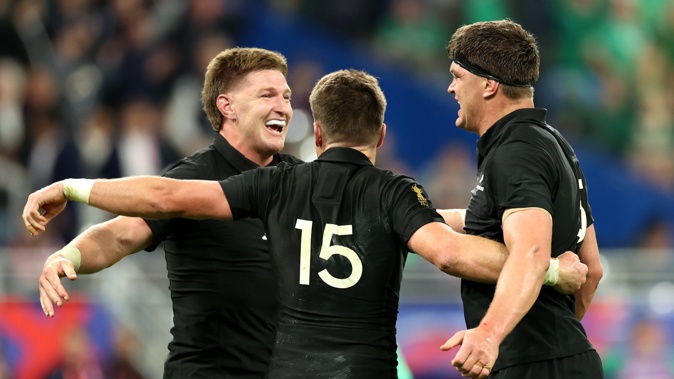 Jordie Barrett, Beauden Barrett and Scott Barrett celebrate following the quarter-final victory over Ireland. Photo / Getty