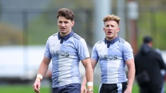 Beauden Barrett, left and Damian McKenzie look on during an All Blacks training session in Wellington. Photo / Getty Images