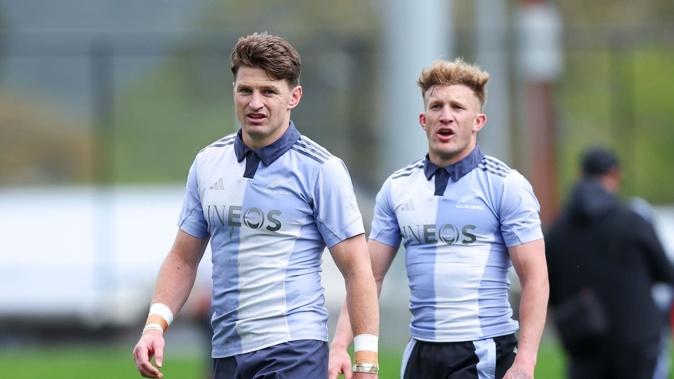 Beauden Barrett, left and Damian McKenzie look on during an All Blacks training session in Wellington. Photo / Getty Images