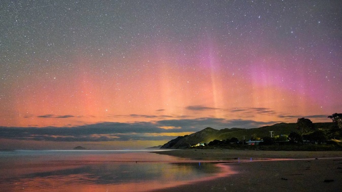 Revin Joseph captured a majestic aurora over Ocean Beach on Friday night. Photo / Revin Joseph