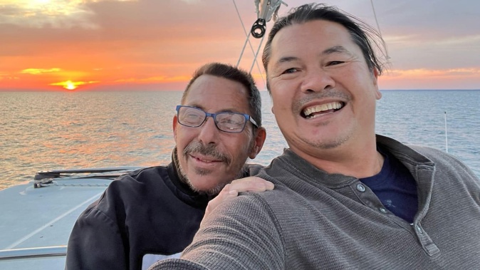 Dave Wickenden, left, and best friend Charles Andrade on board Wickenden's luxury 44 ft Lagoon Catamaran Qori Inti.