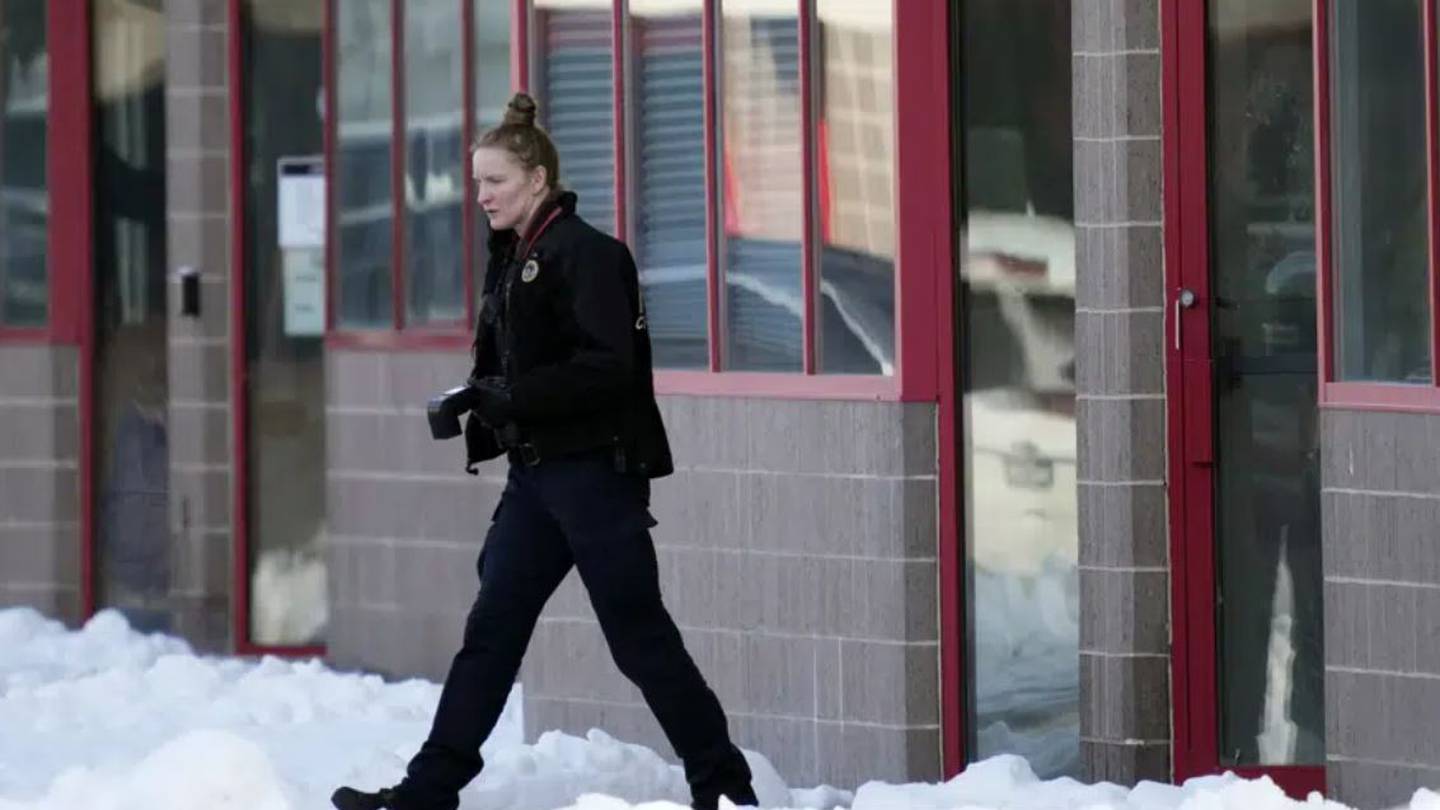 A law enforcement officer exits the Starts Right Here building in Iowa. Photo / AP