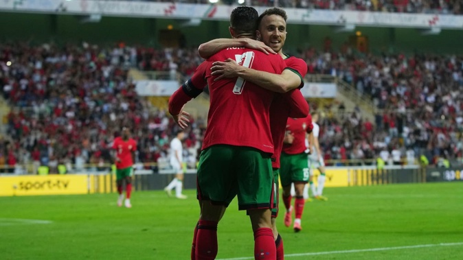Cristiano Ronaldo celebrates with teammate Diogo Jota during a 2024 International Friendly against Republic of Ireland. Photo / Getty Images