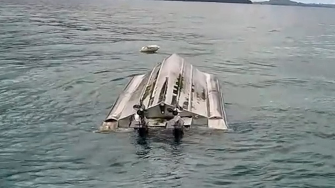 The capsized vessel.