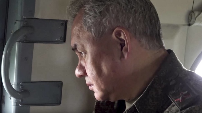 Russian Defence Minister Sergei Shoigu on board a military helicopter on his way to inspect a command post of one of the formations of the Zapad (West) group of Russian troops at an undisclosed location in Ukraine. Photo / AP