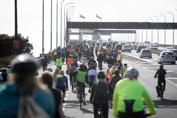 Cyclists cross the Auckland Harbour Bridge after calling for a three-month cycle lane trial. (Photo / Dean Purcell)
