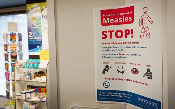 A poster at a medical centre warns against the spread of measles. Photo / Rob Dixon, RNZ