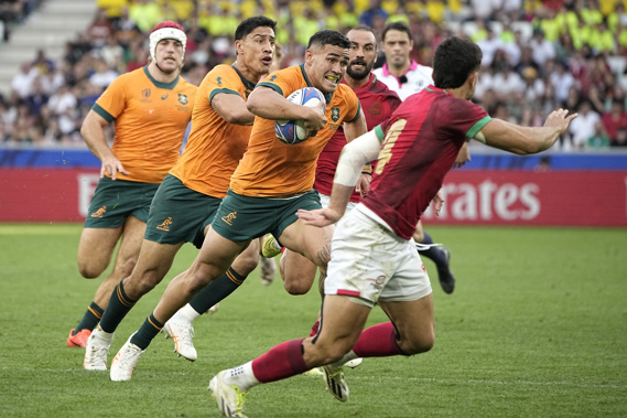 Australia's Izaia Perese runs with the ball. Photo / AP
