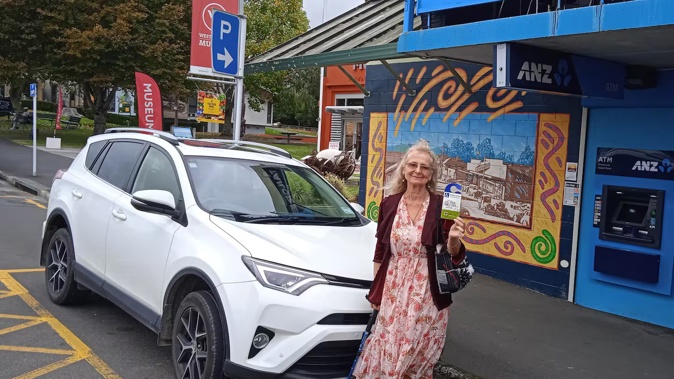 Claire Dale besides what she says is an often-abused mobility parking space along Main Rd, Katikati.