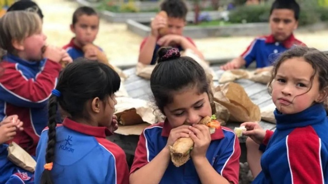 Henry Hill School children tucking into a free school lunch provided through the Ka Ora, Ka Ako Healthy School Lunches Programme. Photo / Ministry of Education