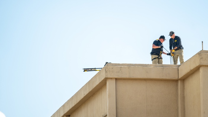 Members of the FBI investigate a building allegedly used by a shooter in the attack near a U.S. Immigration and Customs (ICE) detention facility following a shooting, on September 25, 2025 in Dallas, Texas. (Photo by Brandon Bell/Getty Images)